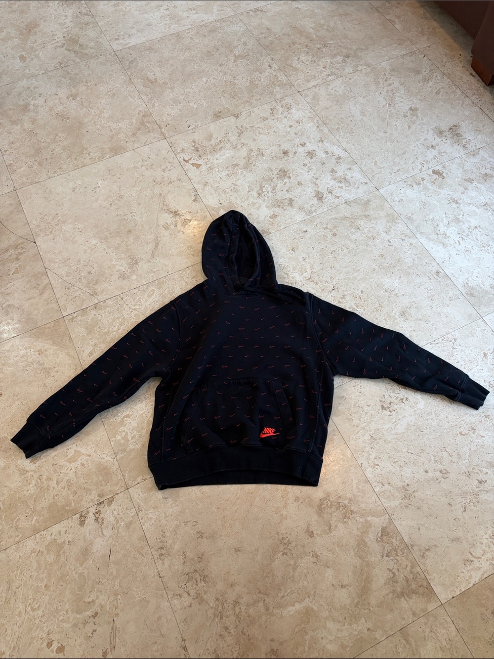 Nike Black Hoodie with Red Swoosh Pattern
